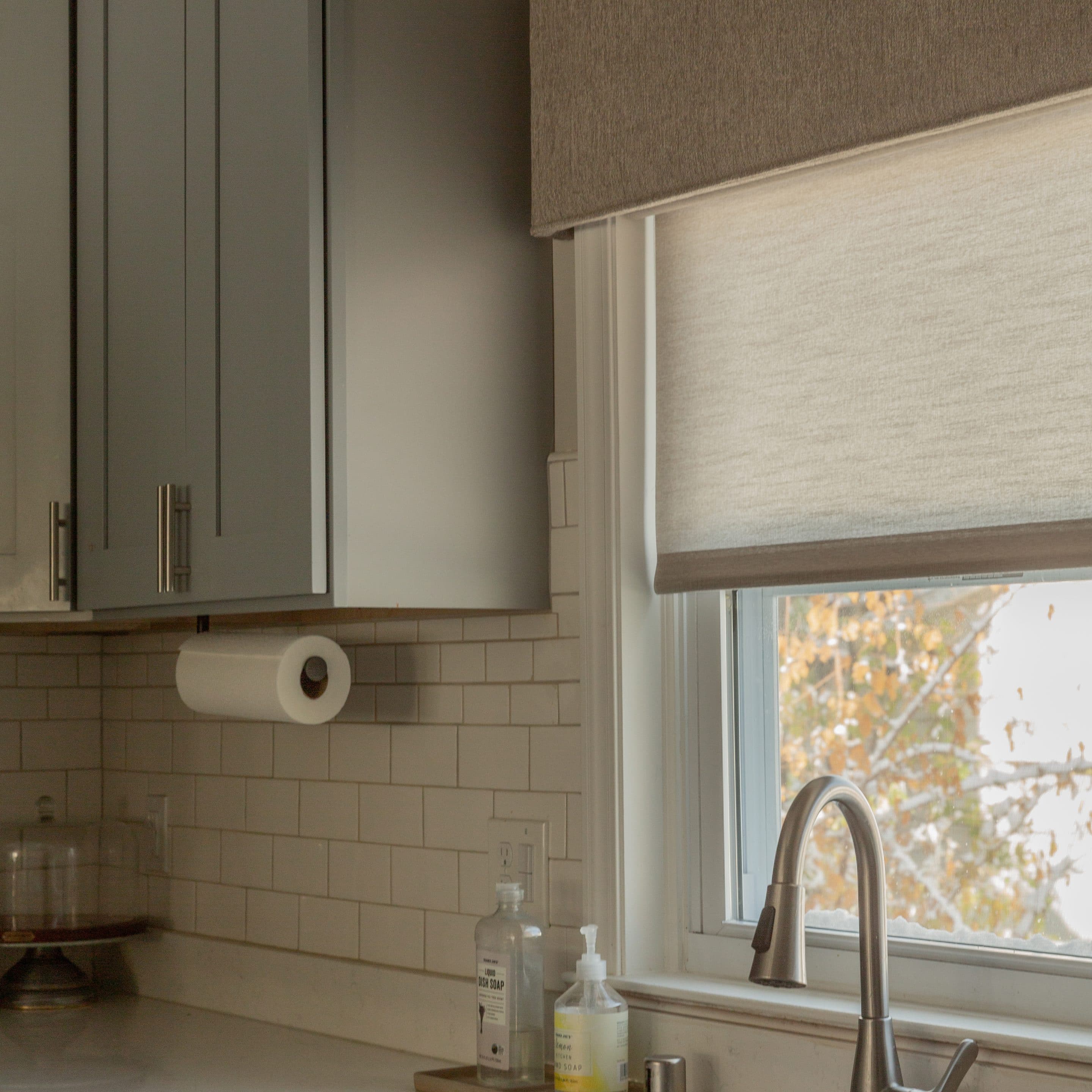 Modern furniture and window with curtains in stylish room interior