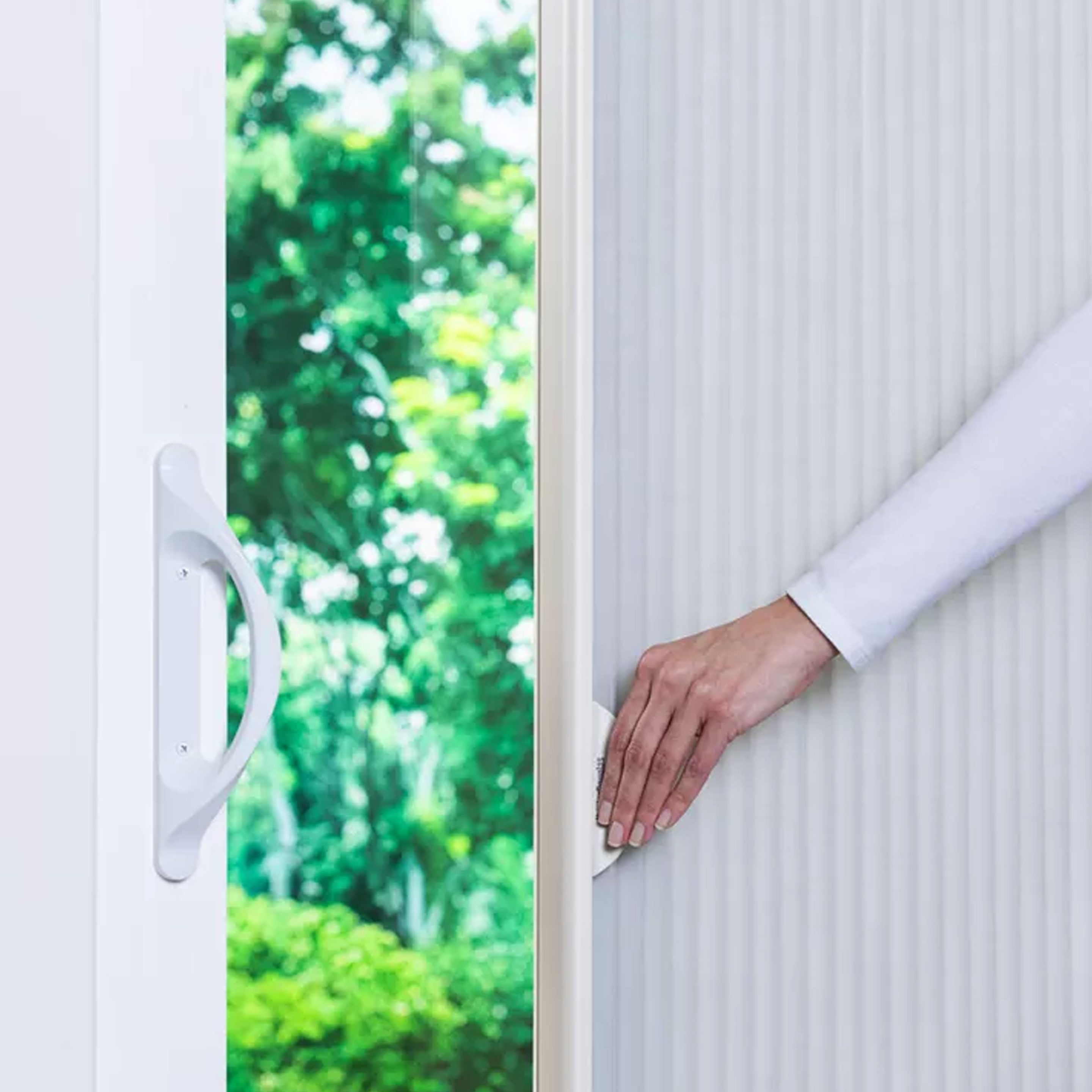 Modern furniture and window with curtains in stylish room interior