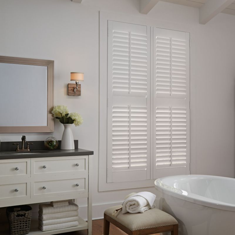 shutters on a window in a bathroom